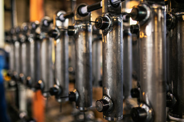 Metal parts are on the rack of the plant used in the automotive industry. Made of steel