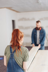 Young couple working doing home renovations