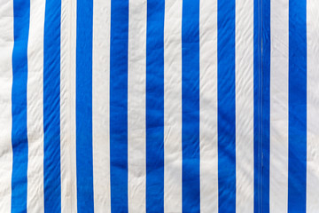 Striped awning in white blue striped, background