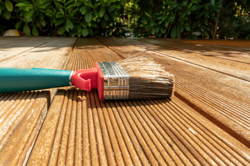 Brush lies on the wet terrace with glaze