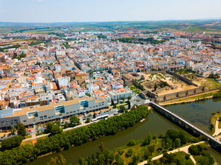 Fototapeta na wymiar Aerial view of Merida cityscape with Roman Bridge
