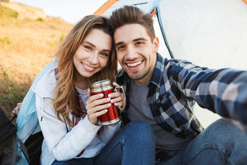 Loving couple outside in free alternative vacation