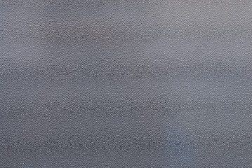 A shiny, reflective, and lightly textured metal surface.