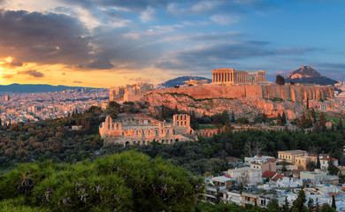 Fototapeta na wymiar The Acropolis of Athens, Greece, with the Parthenon Temple on Acropolis hill during a sunset