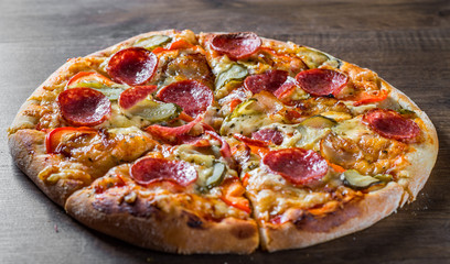 Pepperoni Pizza with Mozzarella cheese, salami, bacon, Tomato sauce, pepper, Spices and pickled...