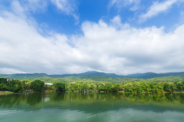 Obraz na płótnie Canvas Mountain range forest with the reservoir blue sky background in Ang Kaew Chiang Mai University,Thailand.