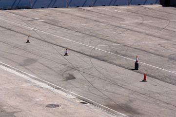 Asphalted area with cones to signal the road to follow the cars