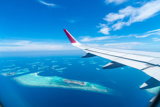 Fototapeta Maldives islands top view from airplane window