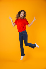 Full length portrait of a lovely cheerful playful young woman