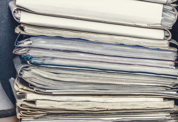 Old paper document folders stacked