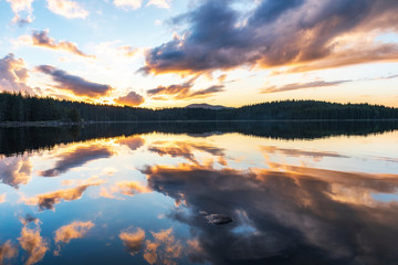 Stunning image of the foggy lake Shiroka poliana in Rhodope mountain, Bulgaria, Europe. Dramatic evening sunset scene. 