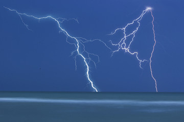 Lightning at sea beach on A thunderstorm cloud