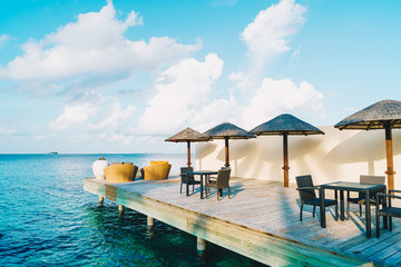 empty outdoor patio deck and chair with blue ocean in Maldives