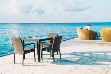 empty outdoor patio deck and chair with blue ocean in Maldives