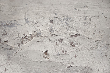 Old concrete wall with peeling paint