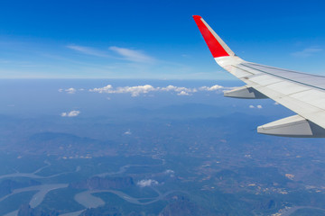 Sky wings and white clouds flying over Phuket, Thailand