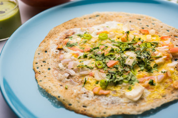 Egg Dosa is a popular south indian non-vegetarian breakfast or meal, served with sambar and chutney