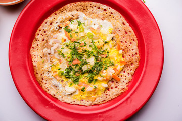 Egg Dosa is a popular south indian non-vegetarian breakfast or meal, served with sambar and chutney