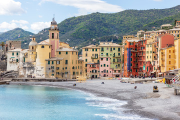 Camogli, Italy. 04-29-2019. Beach and colored houses at Camogli. Liguria. Italy.