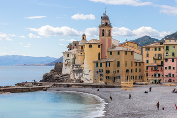 Fototapeta na wymiar Camogli, Italy. 04-29-2019. Beach and colored houses at Camogli. Liguria. Italy.
