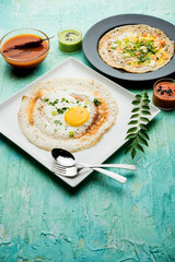Egg Dosa is a popular south indian non-vegetarian breakfast or meal, served with sambar and chutney
