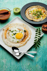 Egg Dosa is a popular south indian non-vegetarian breakfast or meal, served with sambar and chutney