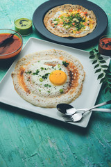 Egg Dosa is a popular south indian non-vegetarian breakfast or meal, served with sambar and chutney