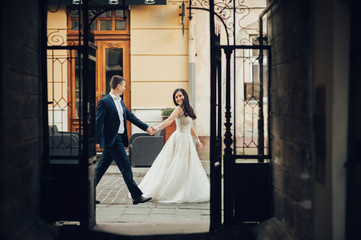 Bride and Groom on Wedding Day in city. Wedding couple after wedding ceremony.