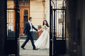 Bride and Groom on Wedding Day in city. Wedding couple after wedding ceremony.