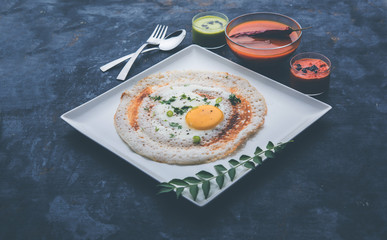 Egg Dosa is a popular south indian non-vegetarian breakfast or meal, served with sambar and chutney