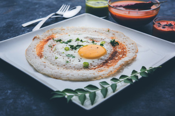 Egg Dosa is a popular south indian non-vegetarian breakfast or meal, served with sambar and chutney