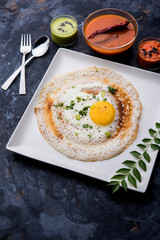 Egg Dosa is a popular south indian non-vegetarian breakfast or meal, served with sambar and chutney