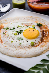 Egg Dosa is a popular south indian non-vegetarian breakfast or meal, served with sambar and chutney