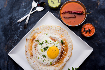 Egg Dosa is a popular south indian non-vegetarian breakfast or meal, served with sambar and chutney