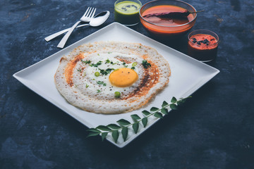 Egg Dosa is a popular south indian non-vegetarian breakfast or meal, served with sambar and chutney