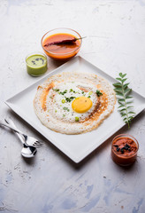 Egg Dosa is a popular south indian non-vegetarian breakfast or meal, served with sambar and chutney