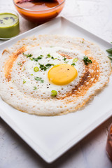 Egg Dosa is a popular south indian non-vegetarian breakfast or meal, served with sambar and chutney
