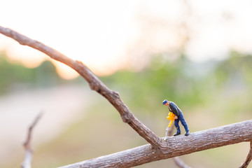 Miniature people : worker are cutting The branches , Deforestation concept. 