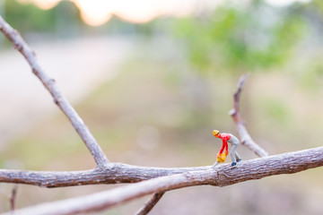 Miniature people : worker are cutting The branches , Deforestation concept. 