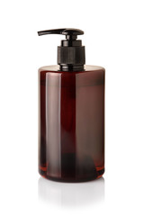 brown plastic  bottle with dispenser pumps isolated on white background with reflection