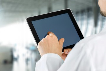 Close-up Doctor at hospital working with tablet pc