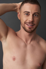 Fototapeta premium Close up portrait of muscle handsome bearded young man after having shower