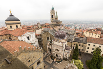 Fototapeta na wymiar Bergamo, Italy. Views of the Old City from the Campanone, with Santa Maria Maggiore, the Cappella Colleoni and the Cathedral of Saint Alexander
