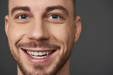 Obraz premium Close up portrait of handsome bearded young man posing in studio