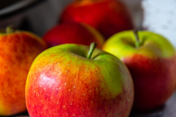 Fresh red, yellow and green apples background