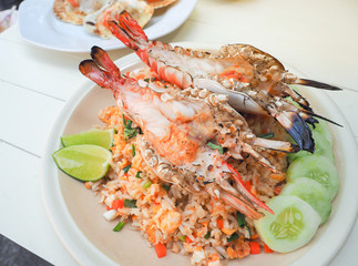 Grilled big tiger shrimps prawns with fried rice dishes.