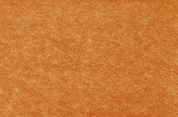Old grungy canvas pattern with dirty spots in orange color.