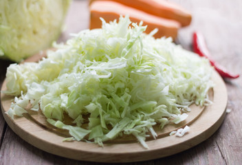 sliced white cabbage fresh on the kitchen table, healthy food concept