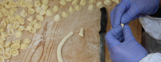 preparation of fresh italian pasta called Orecchiette a typical