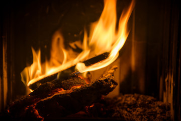 Fire, flames and hot coals in the fireplace. High resolution background.